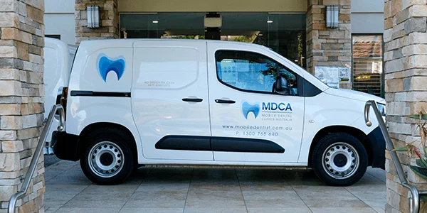 A dental van parked outside an early learning centre