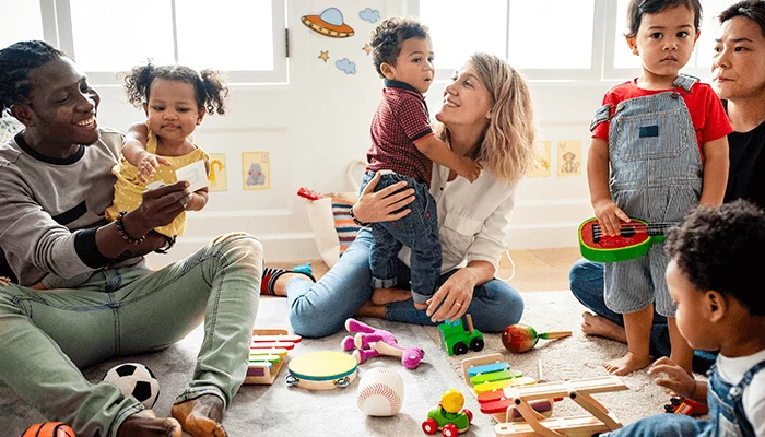 Children in an ELC are playing with toys with their parents